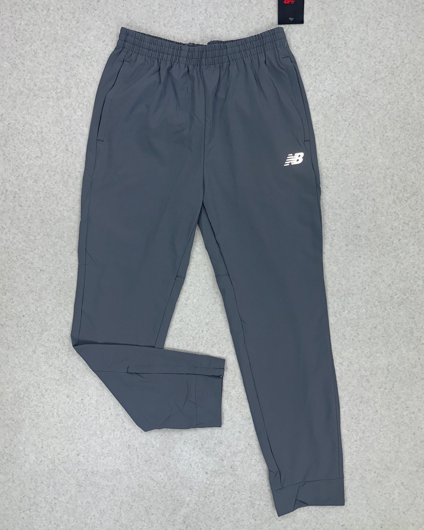 NEW BALANCE WOVEN PANT